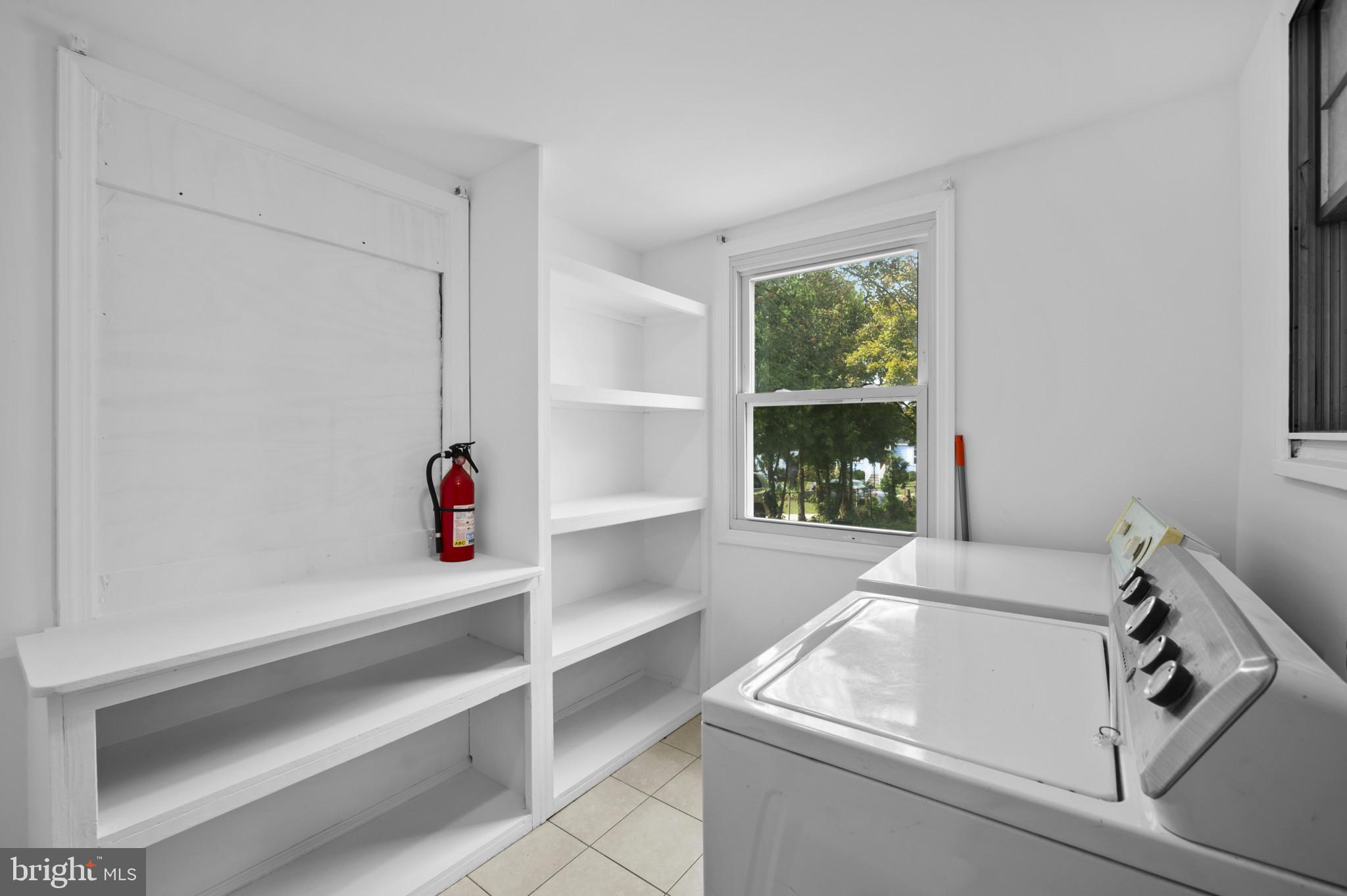12114 Grandview Avenue Silver Spring, MD 20902 - Photo 11 of 24 a bathroom with a sink and a window