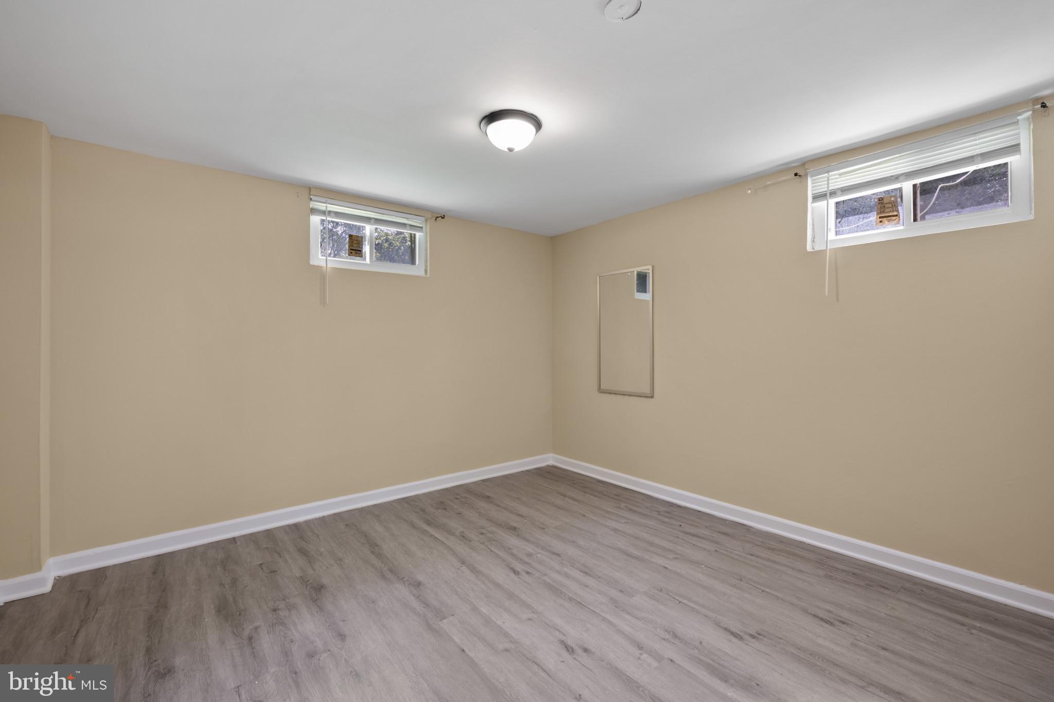 12114 Grandview Avenue Silver Spring, MD 20902 - Photo 17 of 24 a view of a room with wooden floor and a window
