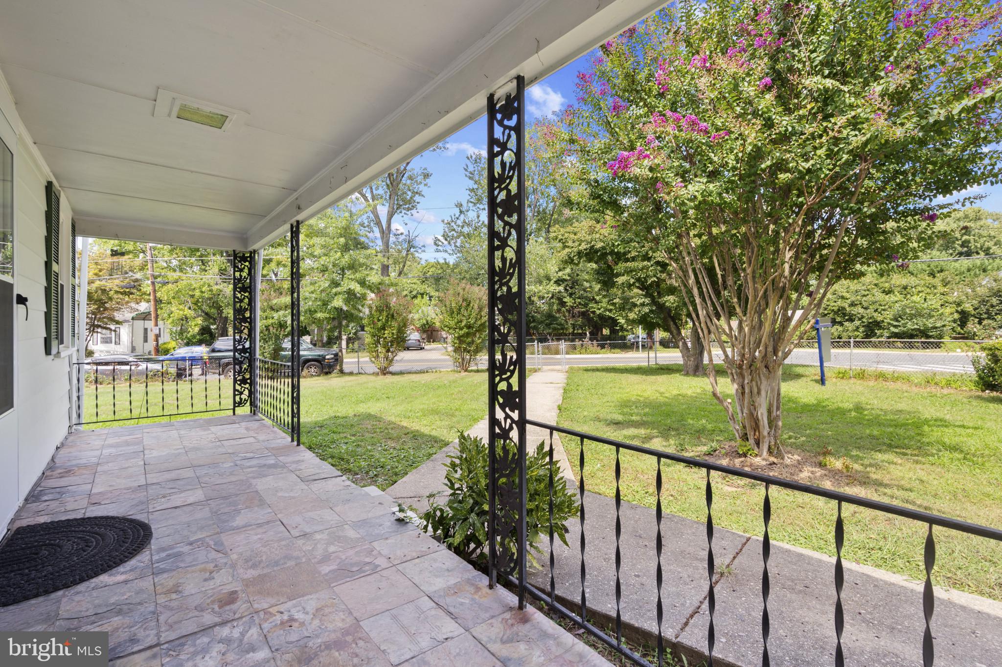 12114 Grandview Avenue Silver Spring, MD 20902 - Photo 4 of 24 a view of a porch with a backyard of the house