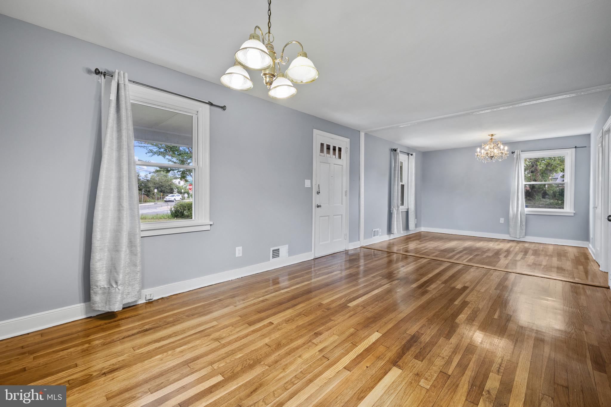 12114 Grandview Avenue Silver Spring, MD 20902 - Photo 7 of 24 a view of empty room with wooden floor and window