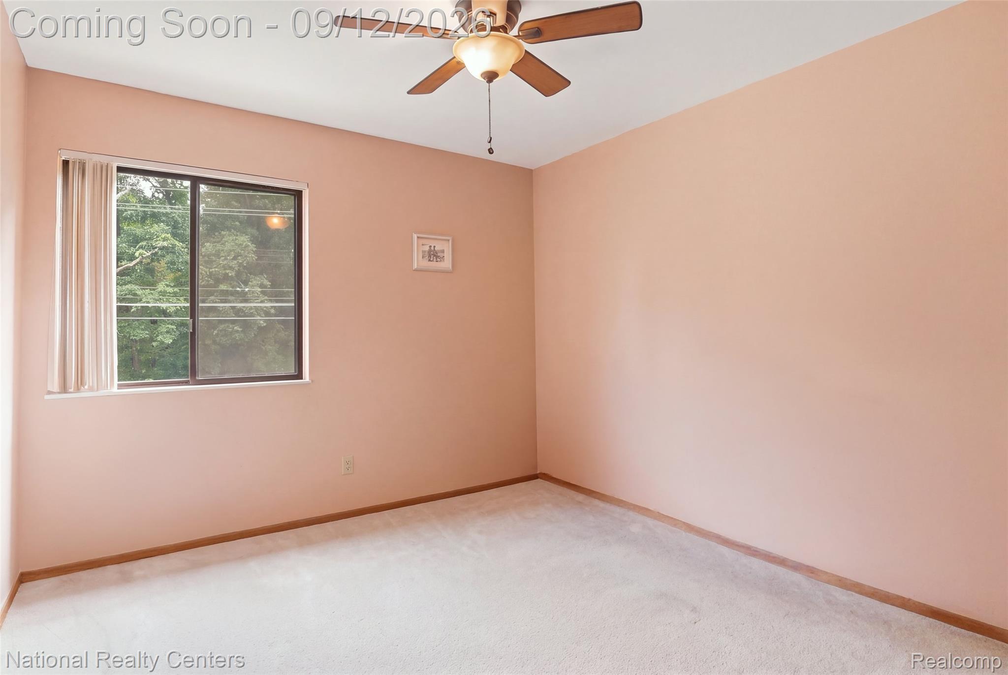 2631 Garden Road Milford, MI 48381 - Photo 13 of 40 Carpeted flooring, a window with vertical blinds, a ceiling fan with integrated lighting, and painted walls