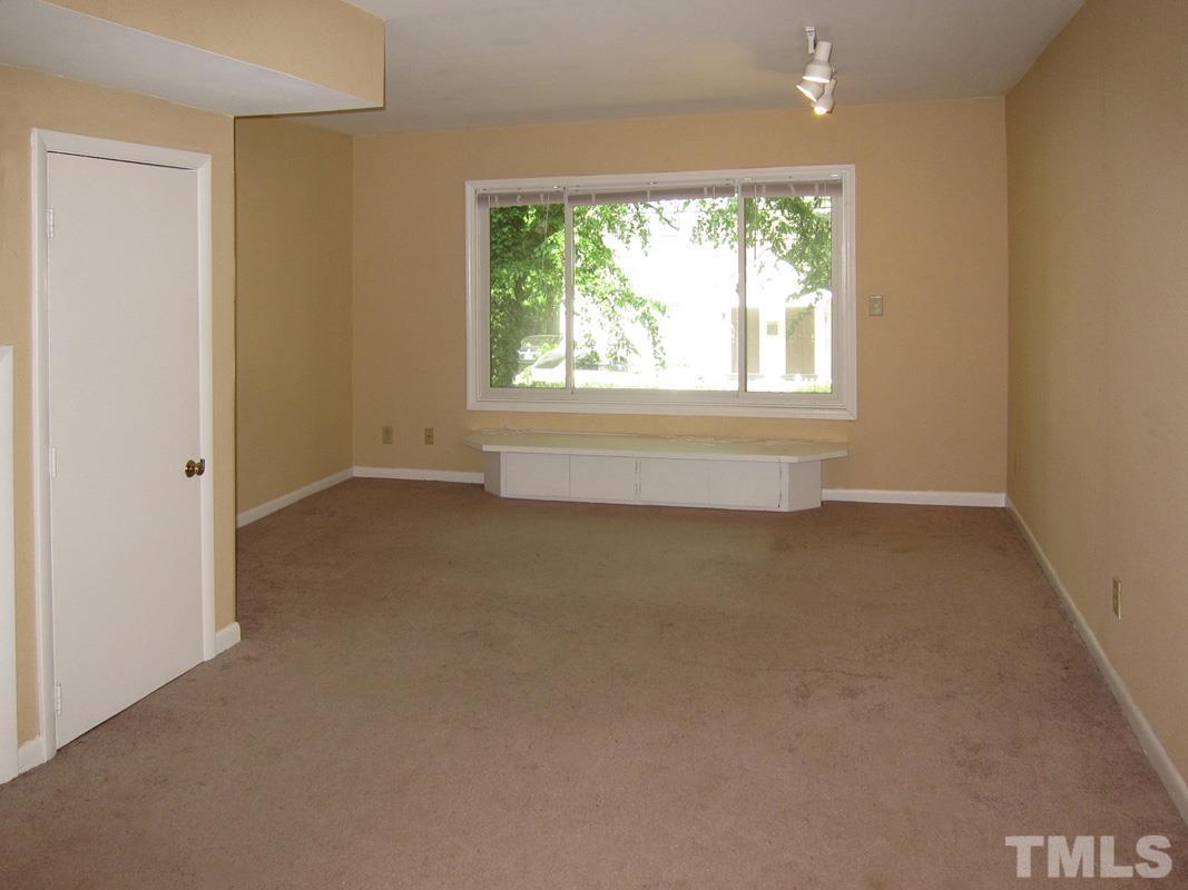 211 Church Street, Unit A8 Chapel Hill, NC 27516 - Photo 2 of 11 a view of an empty room with a window