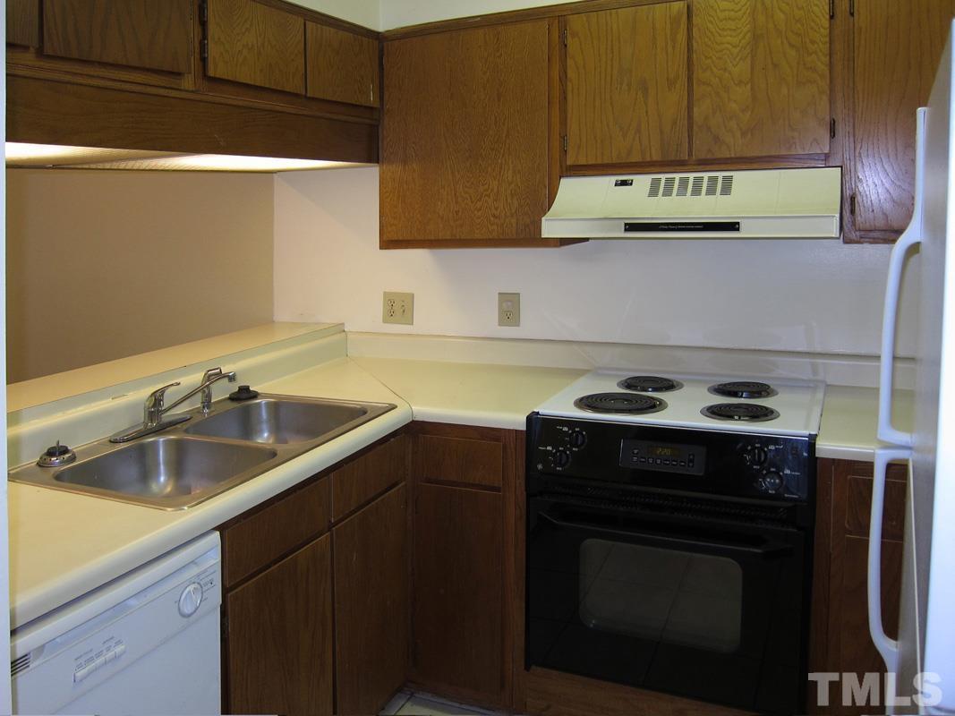 211 Church Street, Unit A8 Chapel Hill, NC 27516 - Photo 5 of 11 a kitchen with a stove and a sink