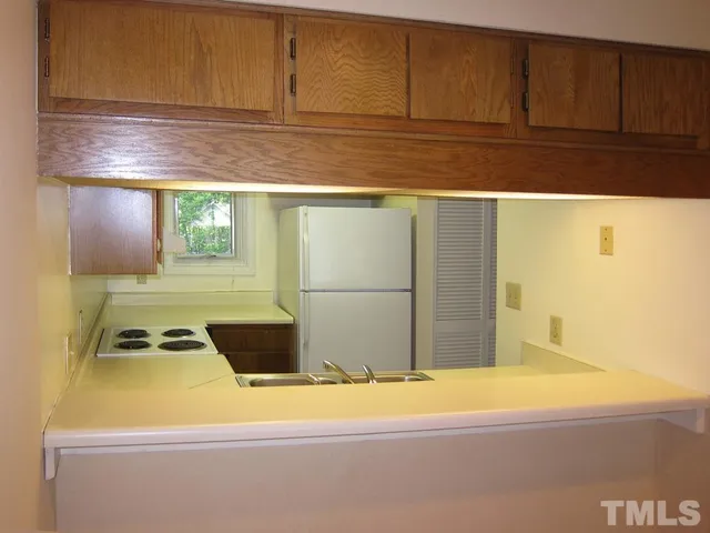 a view of kitchen island with cabinets