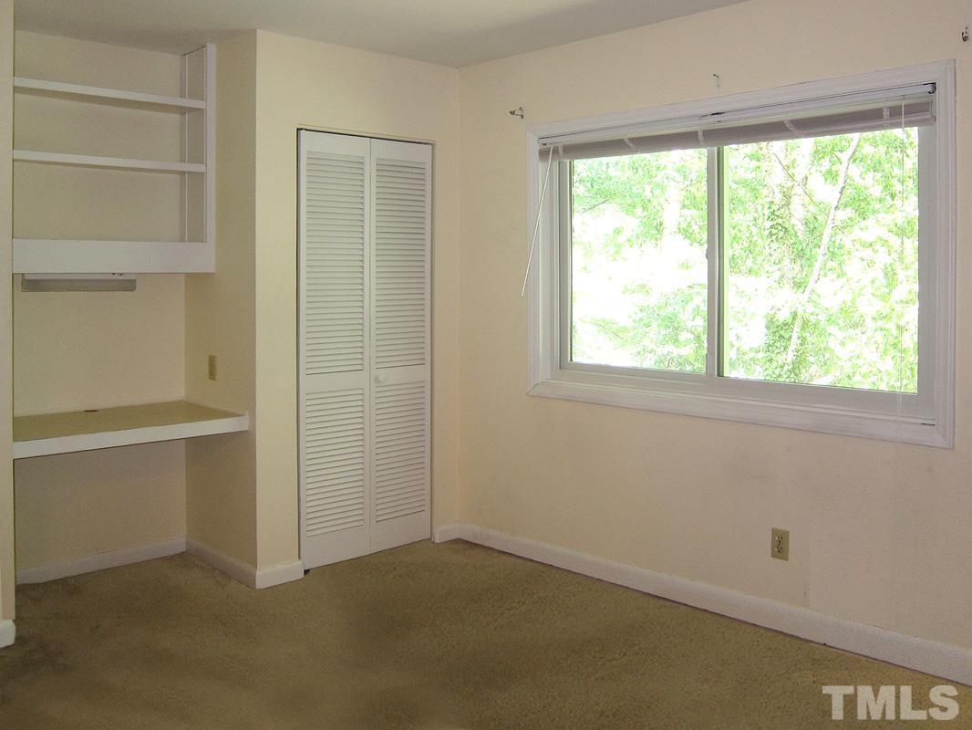 211 Church Street, Unit A8 Chapel Hill, NC 27516 - Photo 8 of 11 an empty room with a window