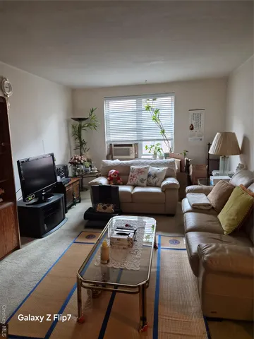 a kitchen with sink refrigerator and stove