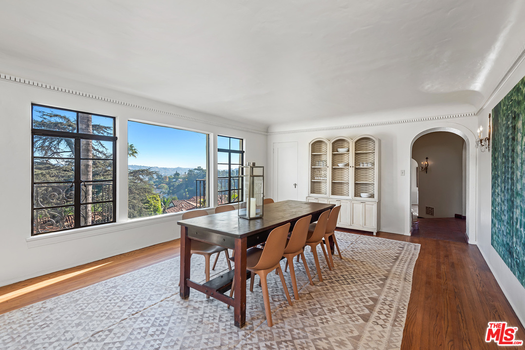 3551 Lowry Road Los Angeles, CA 90027 - Photo 12 of 50 a dining room with furniture and wooden floor