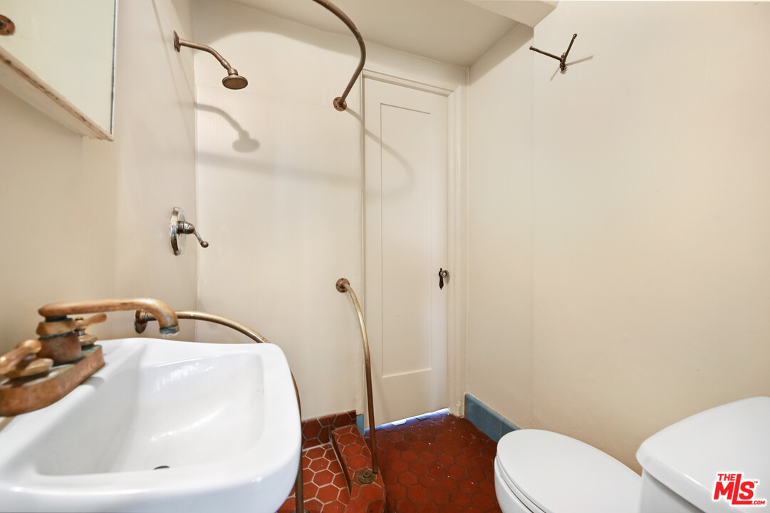 3551 Lowry Road Los Angeles, CA 90027 - Photo 16 of 50 a bathroom with a sink and toilet