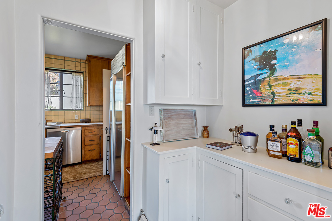 3551 Lowry Road Los Angeles, CA 90027 - Photo 18 of 50 a kitchen with stainless steel appliances a refrigerator and cabinets