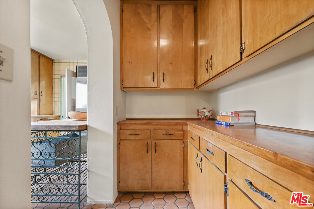 3551 Lowry Road Los Angeles, CA 90027 - Photo 24 of 50 a kitchen with stainless steel appliances granite countertop a sink and cabinets
