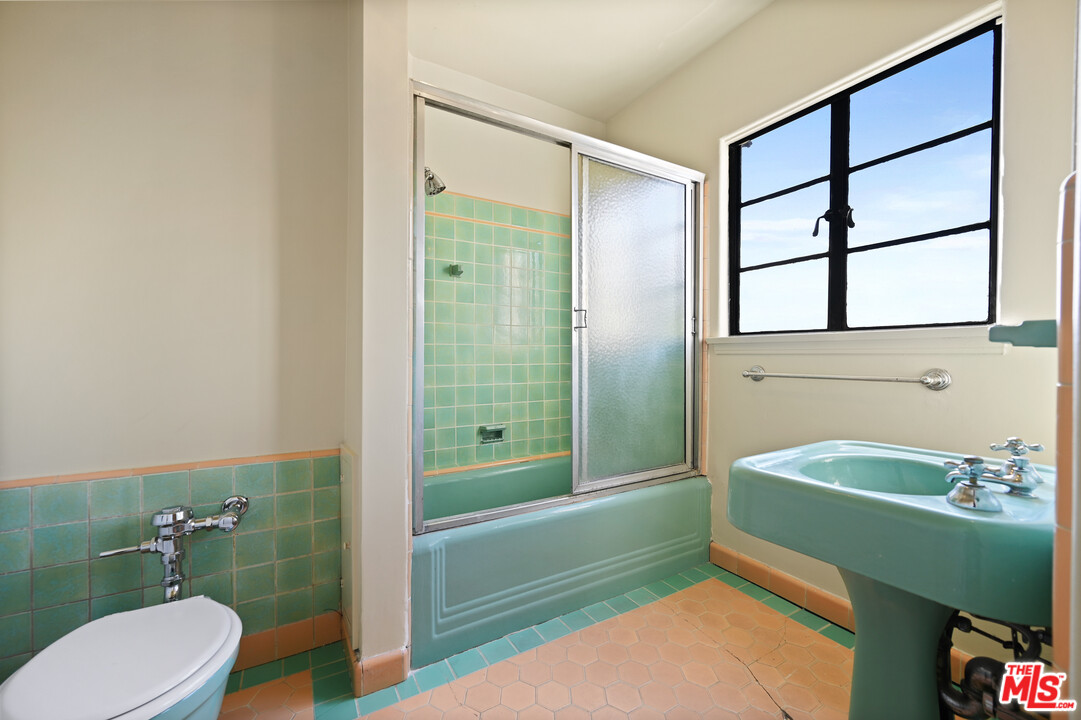 3551 Lowry Road Los Angeles, CA 90027 - Photo 36 of 50 a bathroom with a sink a toilet and shower
