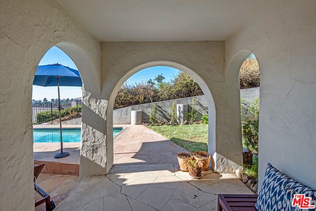 a view of a backyard with sitting area