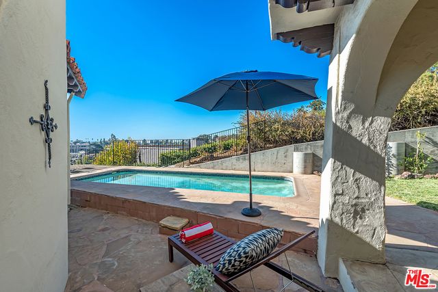 a view of roof deck with patio
