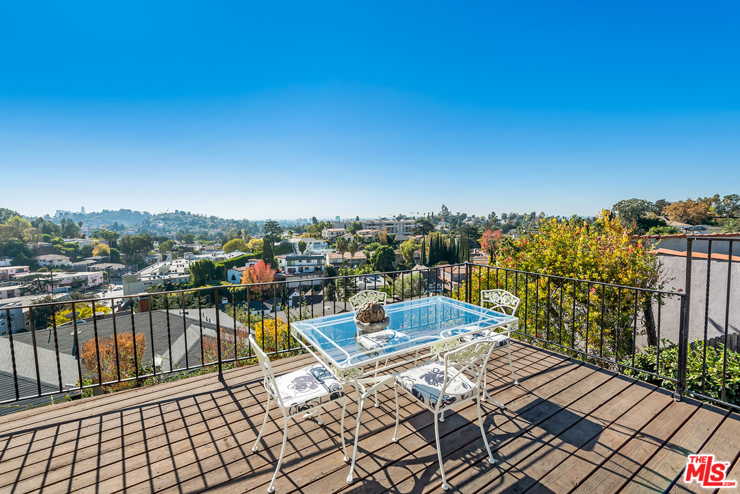 3551 Lowry Road Los Angeles, CA 90027 - Photo 42 of 50 a view of a balcony with wooden floor and city view