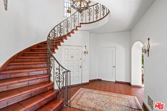 a room with a table and a fireplace