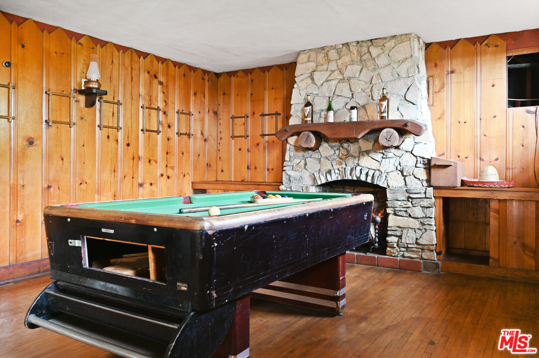 3551 Lowry Road Los Angeles, CA 90027 - Photo 46 of 50 a room with a table and a fireplace