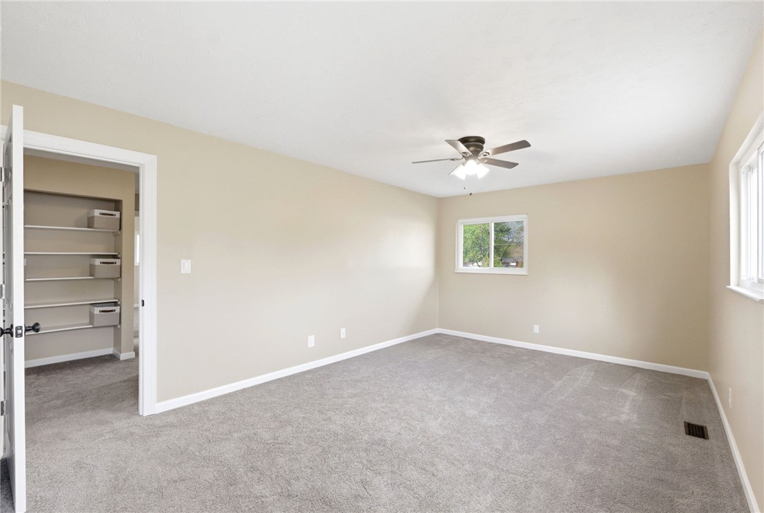 40 Woods Road Springboro, OH 45066 - Photo 52 of 57 This spacious bedroom offers comfortable carpeting and a bright window, creating a serene personal retreat.