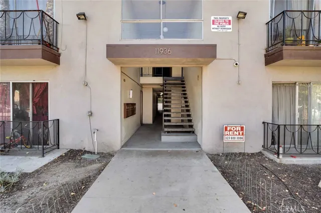 a view of parking area with parked cars
