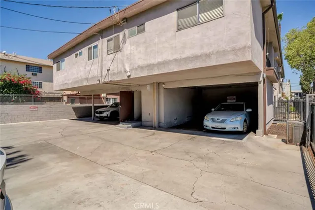 a view of car parked in front of house