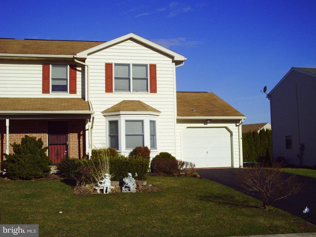 92 Sunrise Circle Denver, PA 17517 - Photo 1 of 15 a front view of a house with a yard