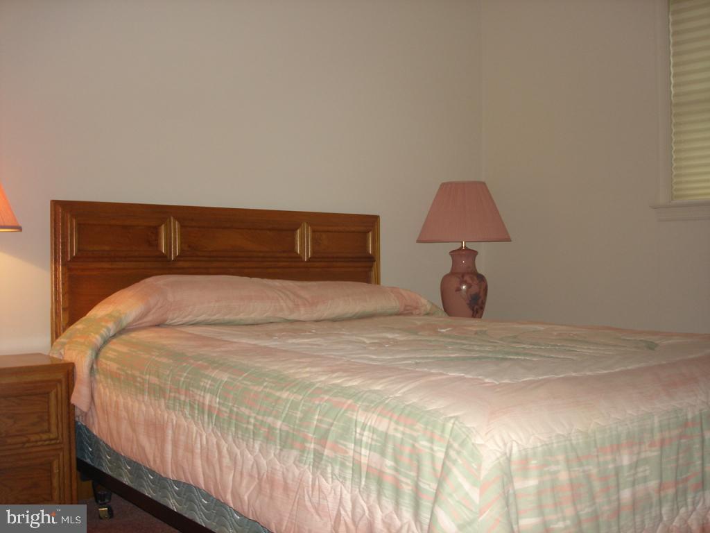 92 Sunrise Circle Denver, PA 17517 - Photo 11 of 15 a bedroom with a bed and a lamp