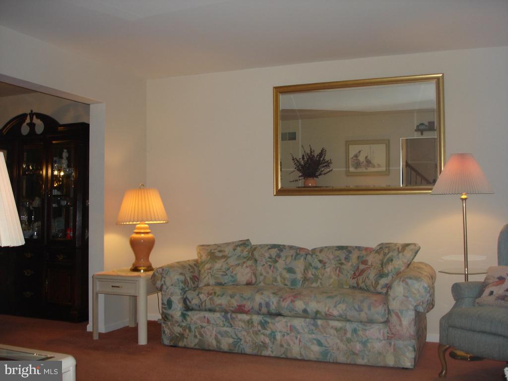 92 Sunrise Circle Denver, PA 17517 - Photo 15 of 15 a living room with furniture and a painting on the wall