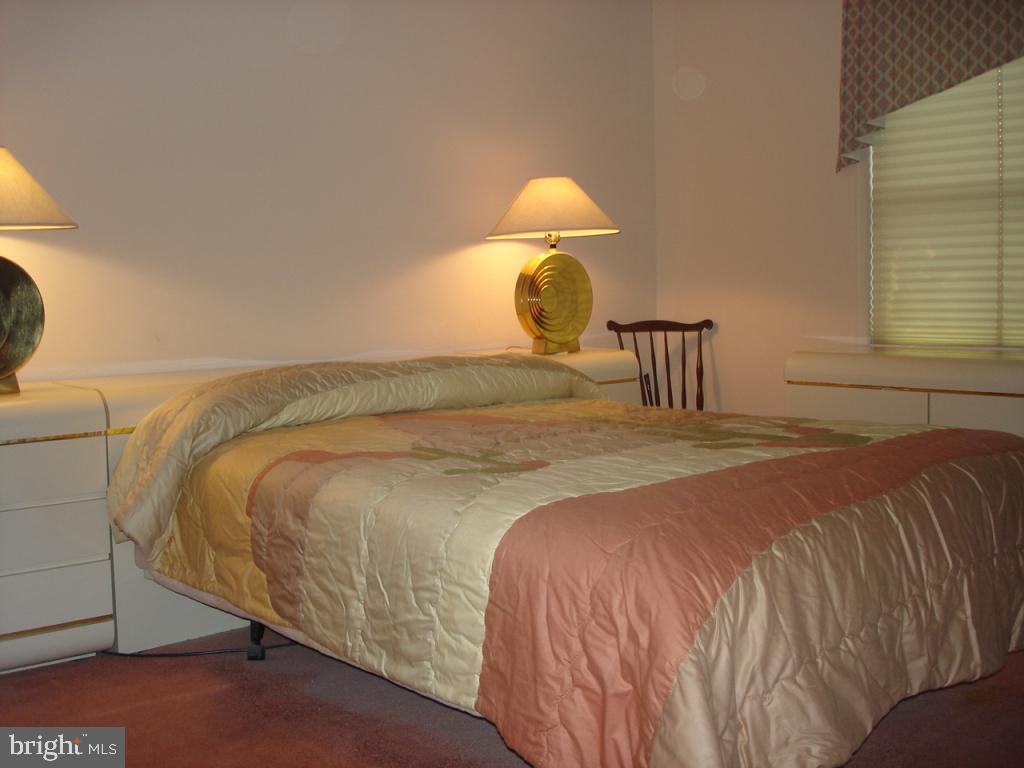 92 Sunrise Circle Denver, PA 17517 - Photo 10 of 15 a bedroom with a bed and a lamp