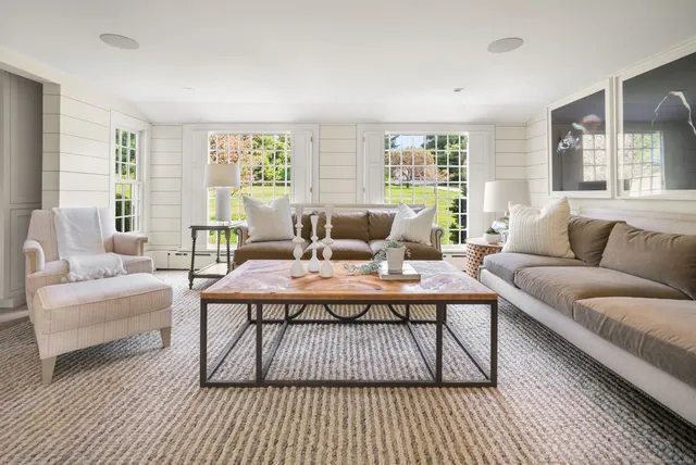 a living room with furniture and a rug