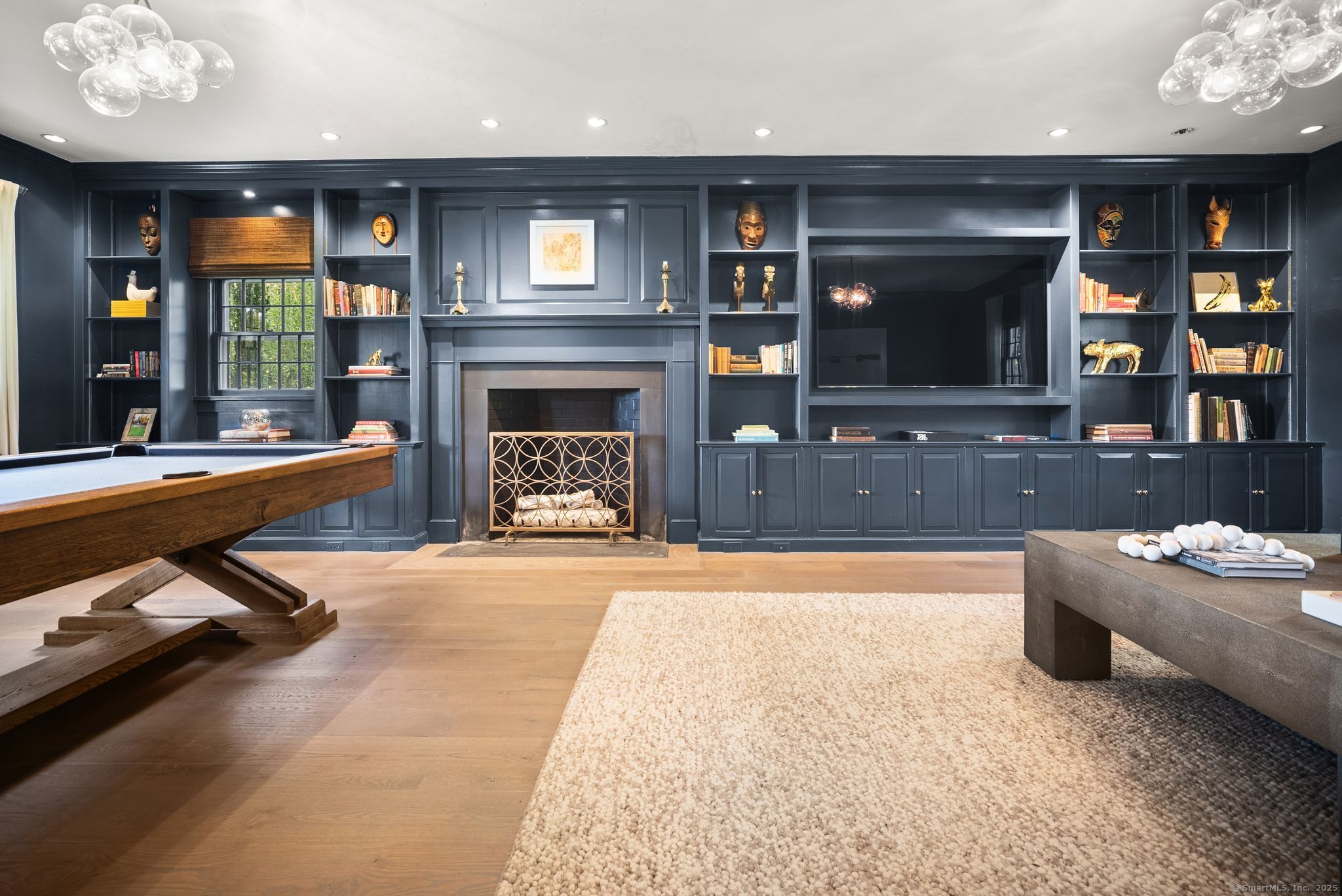 2281 Redding Road Fairfield, CT 06824 - Photo 16 of 40 a living room with furniture and a fireplace