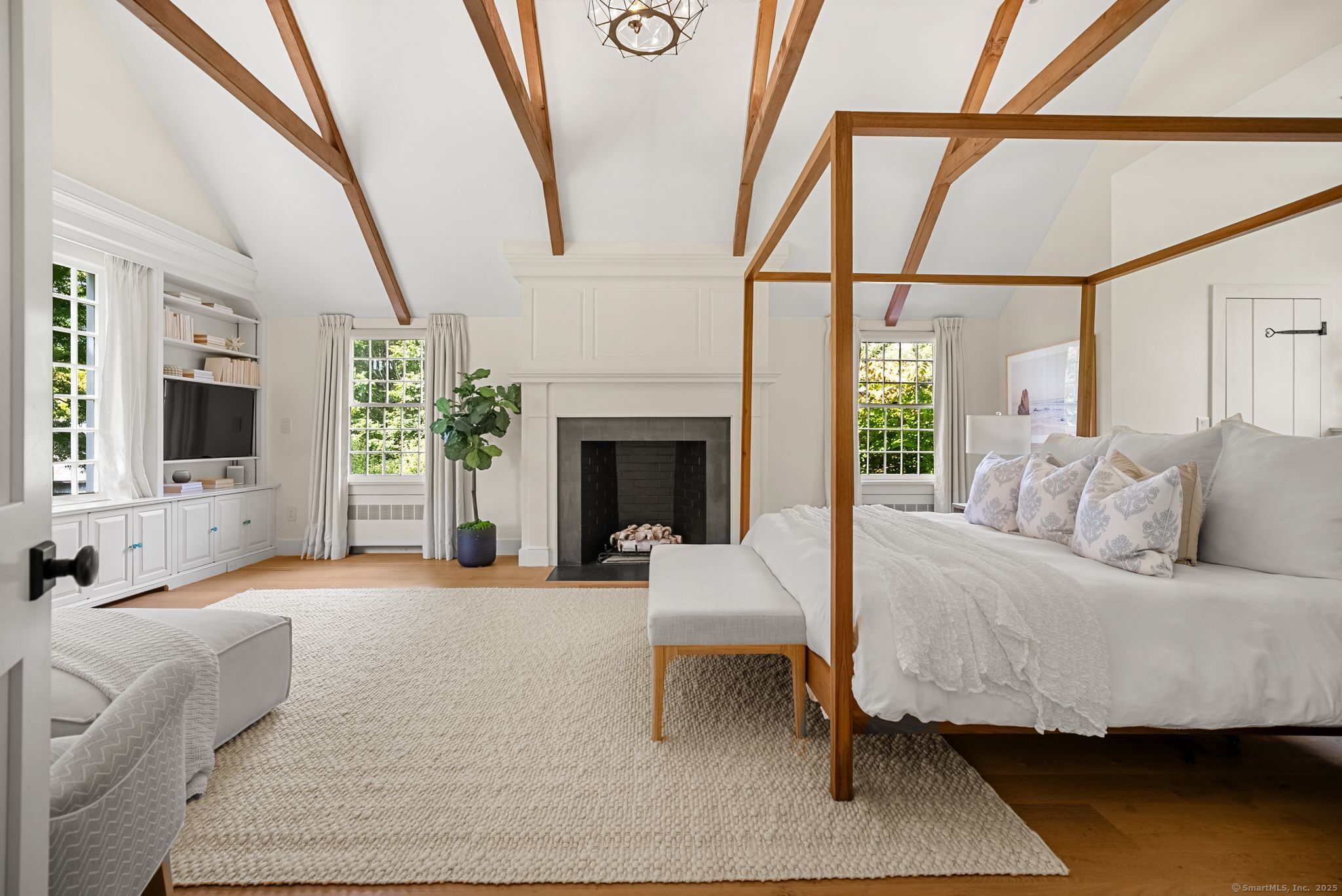 2281 Redding Road Fairfield, CT 06824 - Photo 18 of 40 a living room with furniture and a fireplace
