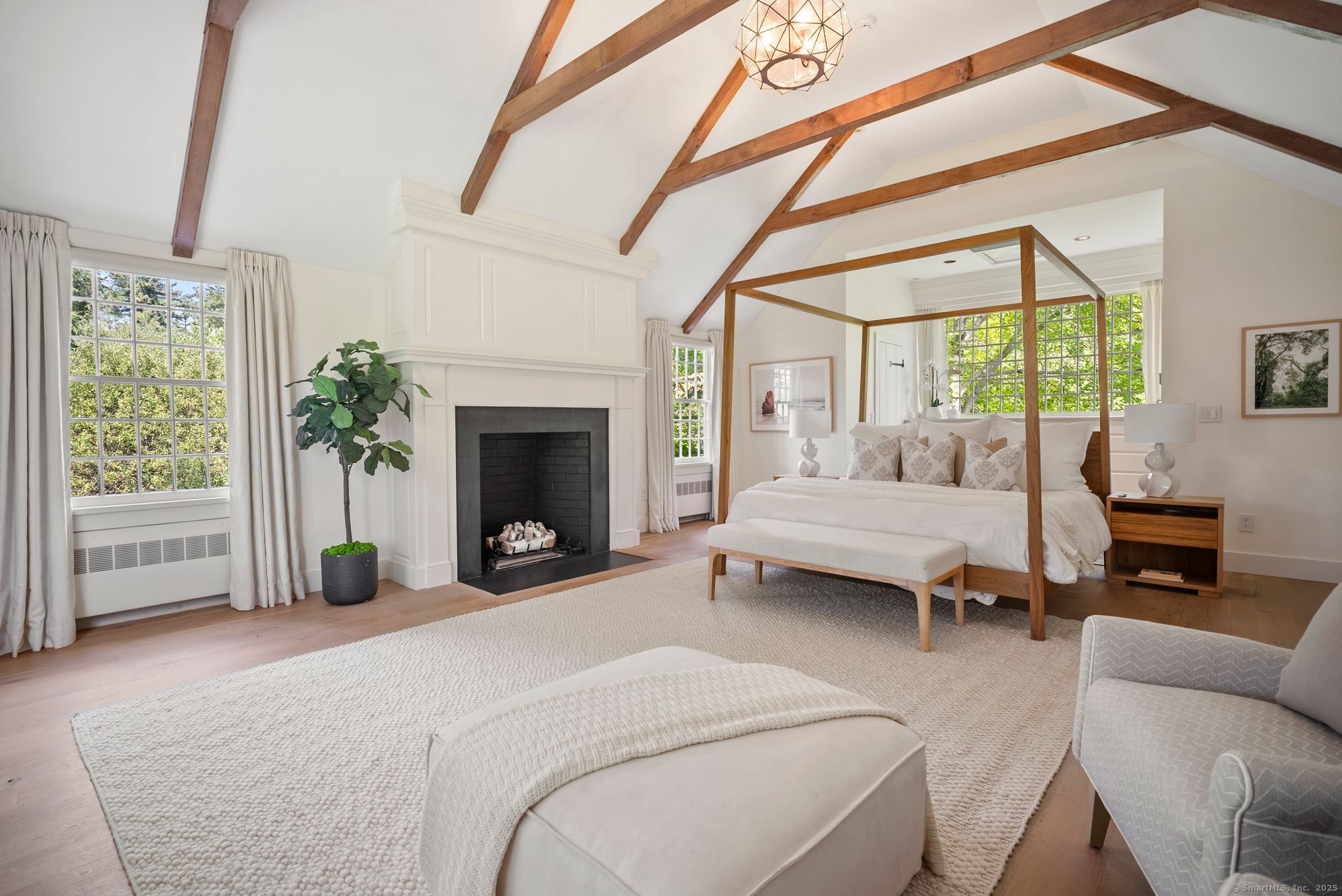 2281 Redding Road Fairfield, CT 06824 - Photo 20 of 40 a bedroom with furniture and a fireplace