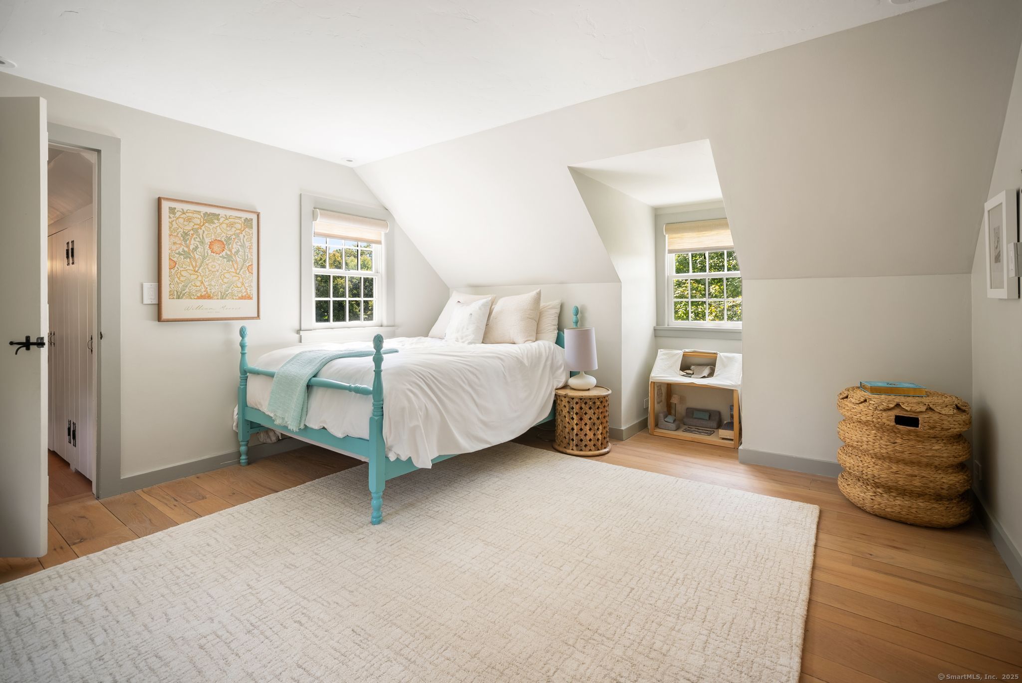 2281 Redding Road Fairfield, CT 06824 - Photo 22 of 40 a spacious bedroom with a bed and a couch