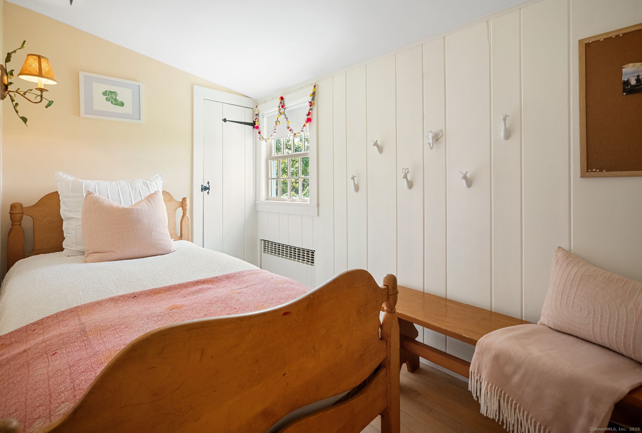 2281 Redding Road Fairfield, CT 06824 - Photo 24 of 40 a bedroom with a bed and a chair