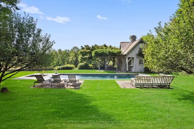 a view of a house with a yard porch and sitting area