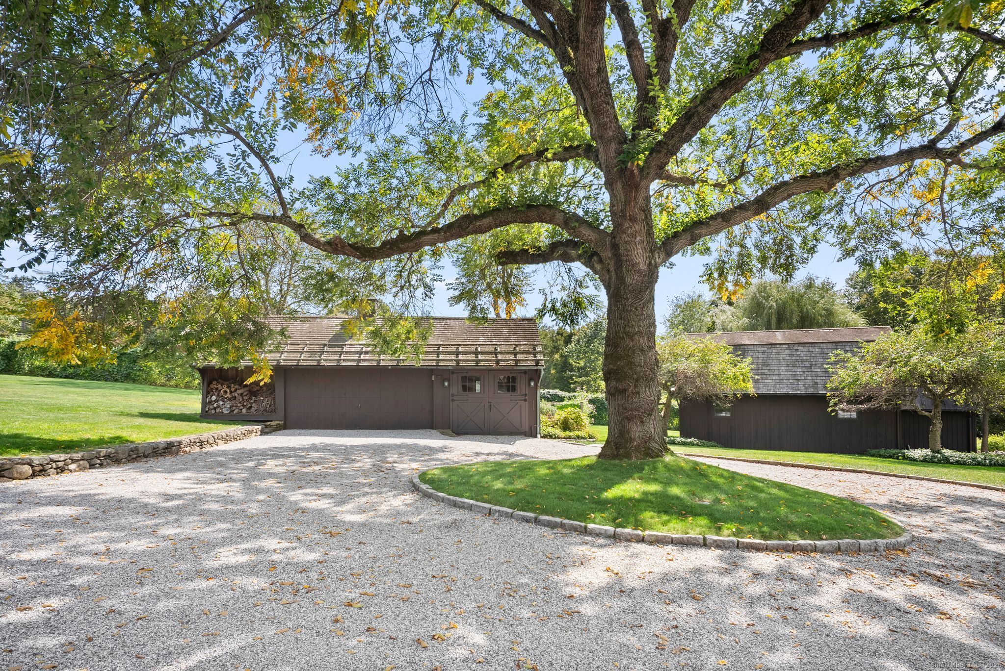 2281 Redding Road Fairfield, CT 06824 - Photo 33 of 40 a view of a house with a yard and tree s