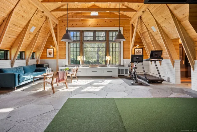an aerial view of a house with a yard basket ball court and outdoor seating
