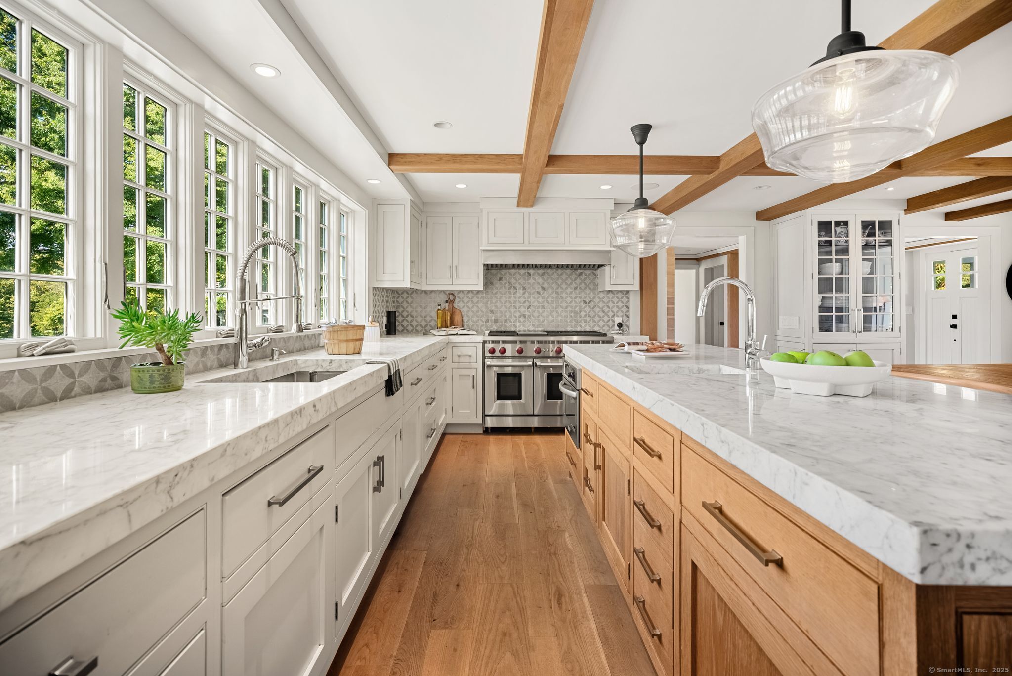 2281 Redding Road Fairfield, CT 06824 - Photo 7 of 40 a large kitchen with stainless steel appliances lots of counter space and a sink