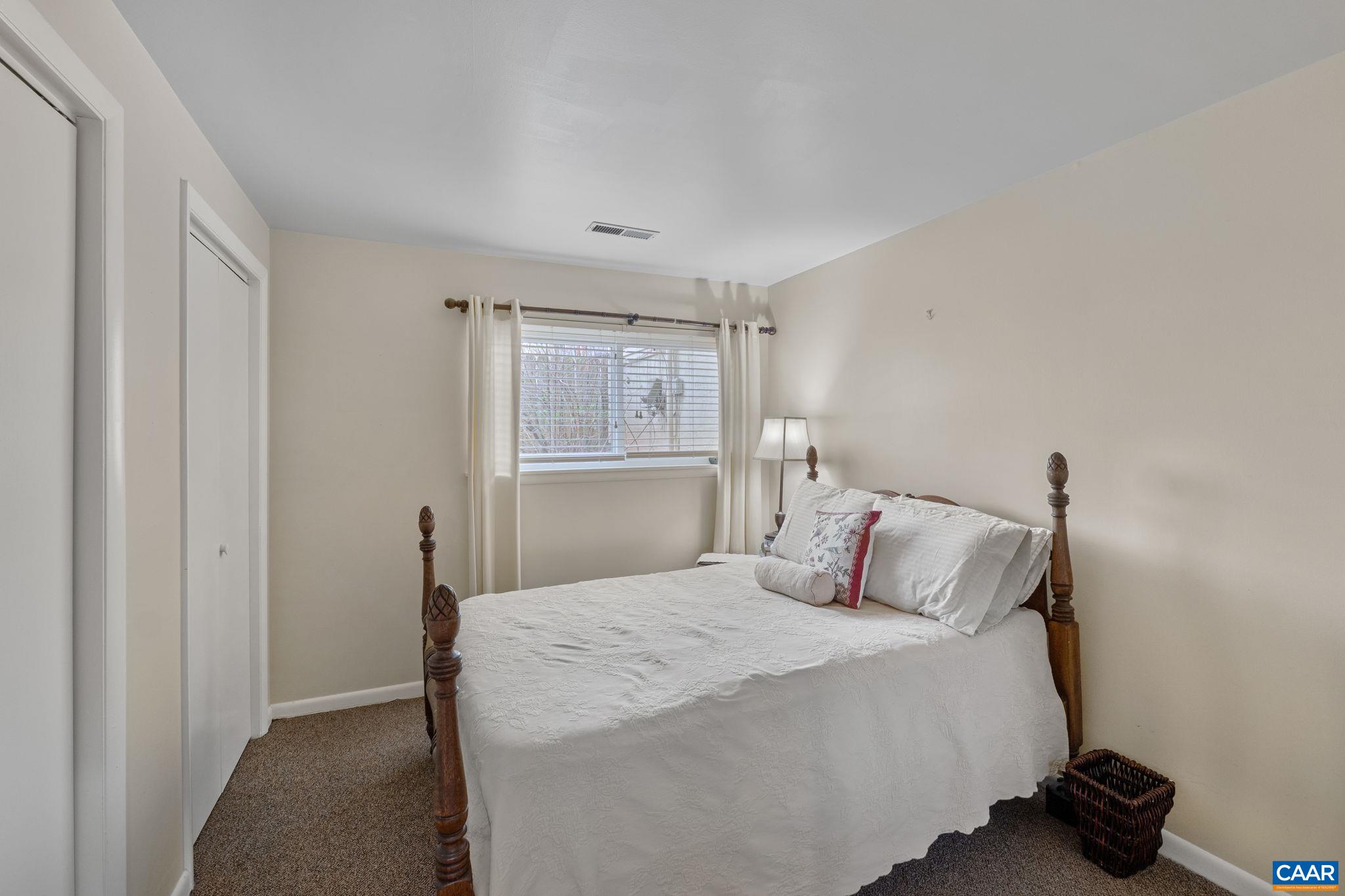 1212 Chatham Ridge Charlottesville, VA 22901 - Photo 13 of 17 a bedroom with a bed and a window