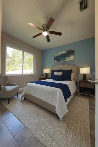 a view of a back yard with flower plants