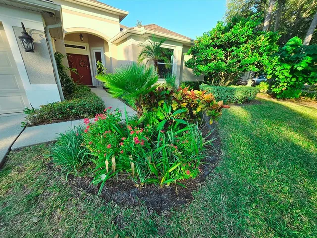 a kitchen with a refrigerator and a stove top oven