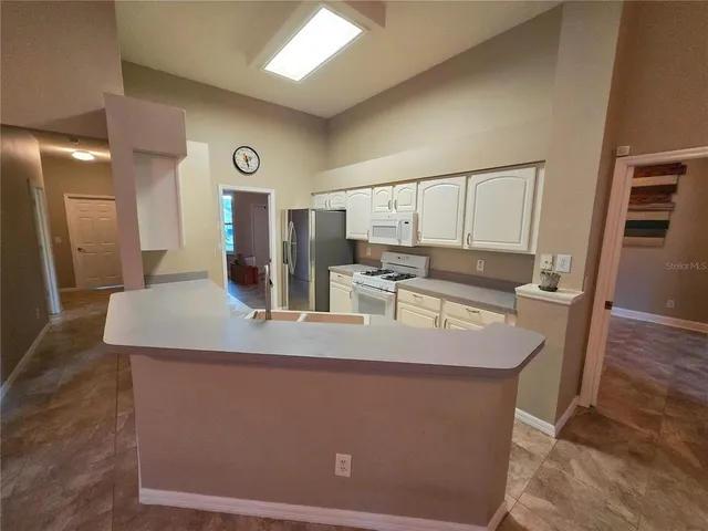 a view of a balcony with wooden floor and outdoor space