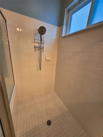 a view of a swimming pool with a lounge chair