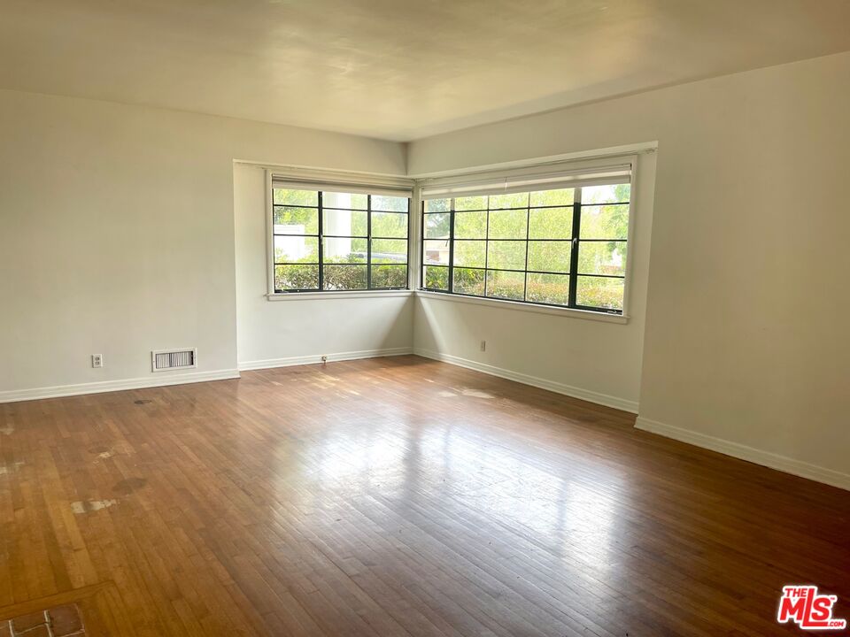101 Larkin Place Santa Monica, CA 90402 - Photo 10 of 13 wooden floor in an empty room with a window
