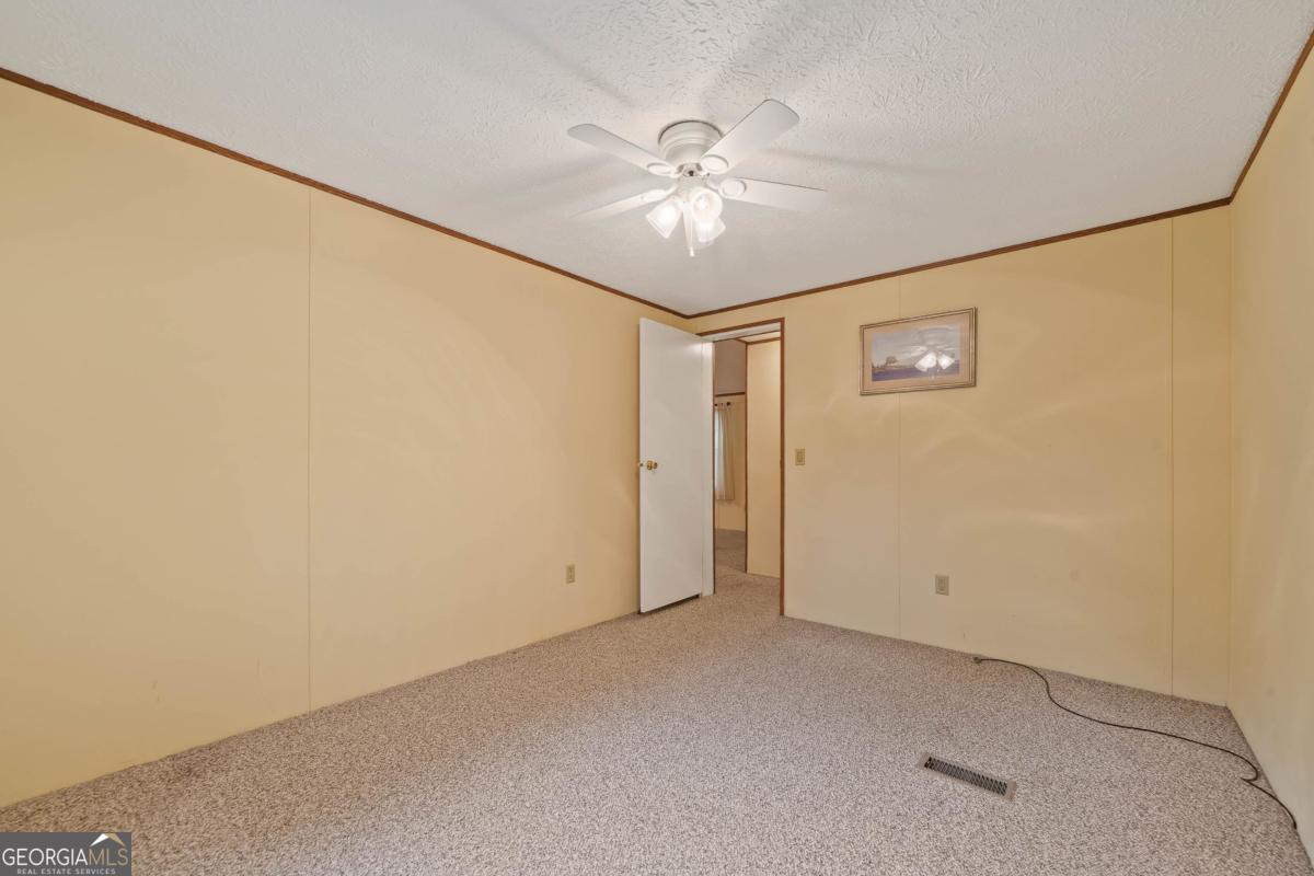 180 De Jarnette Road Southeast Eatonton, GA 31024 - Photo 27 of 66 a view of an empty room