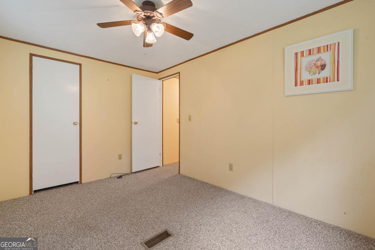 180 De Jarnette Road Southeast Eatonton, GA 31024 - Photo 32 of 66 a view of an empty room