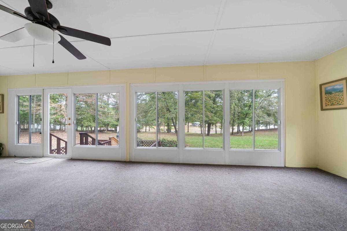 180 De Jarnette Road Southeast Eatonton, GA 31024 - Photo 35 of 66 a view of an empty room with windows
