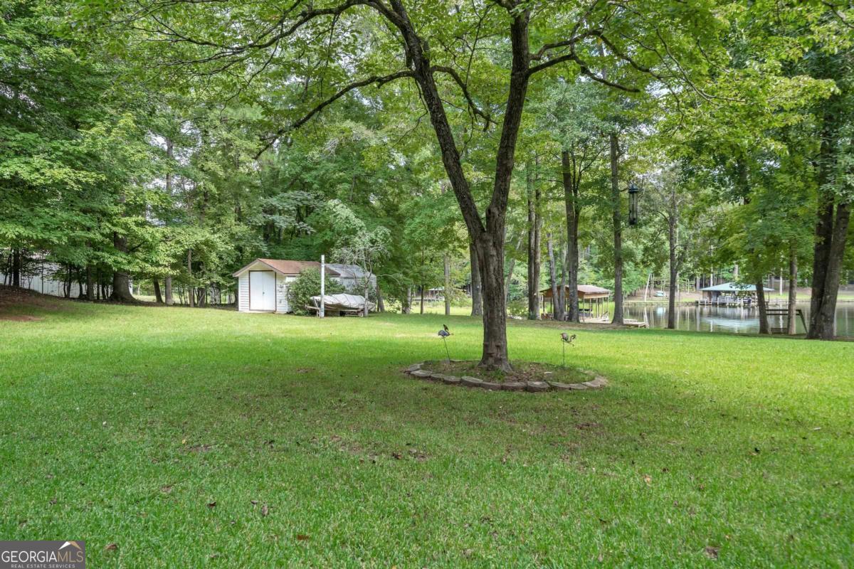 180 De Jarnette Road Southeast Eatonton, GA 31024 - Photo 48 of 66 a view of a trees in a park