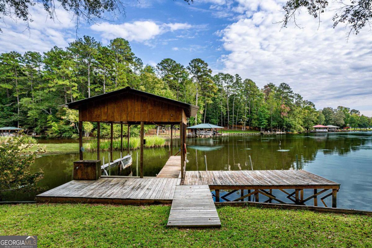 180 De Jarnette Road Southeast Eatonton, GA 31024 - Photo 51 of 66 a view of a garden with a lake view