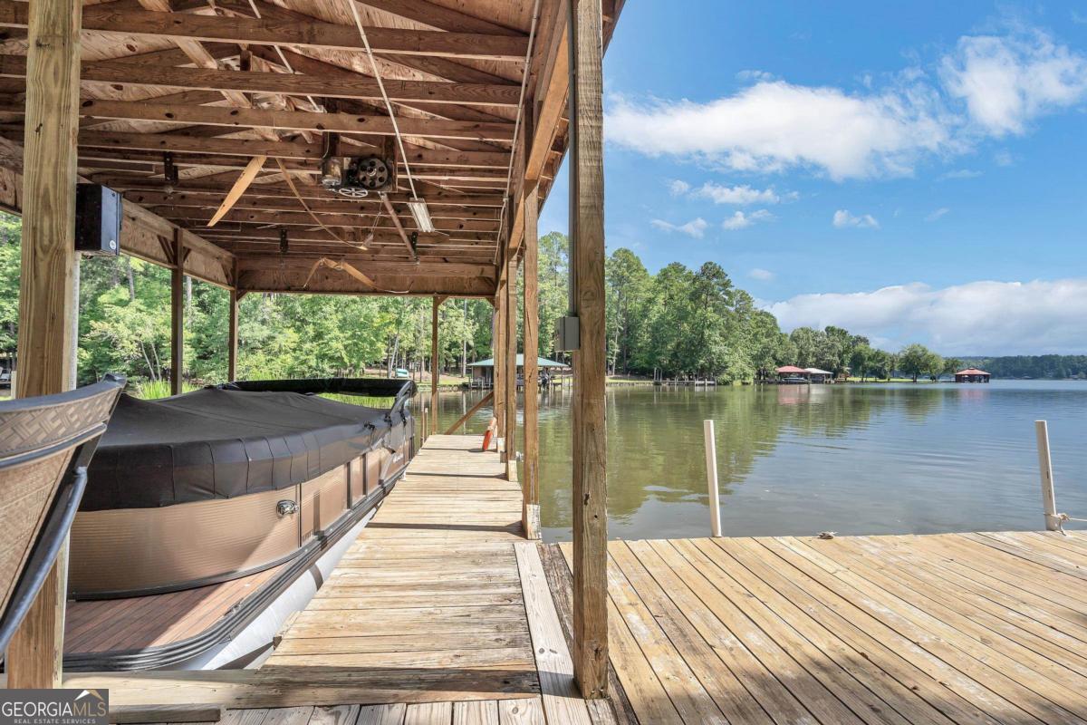 180 De Jarnette Road Southeast Eatonton, GA 31024 - Photo 53 of 66 a view of swimming pool with a patio and a yard in the back