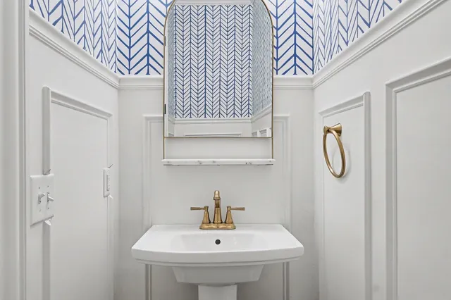 a bathroom with a sink and a mirror